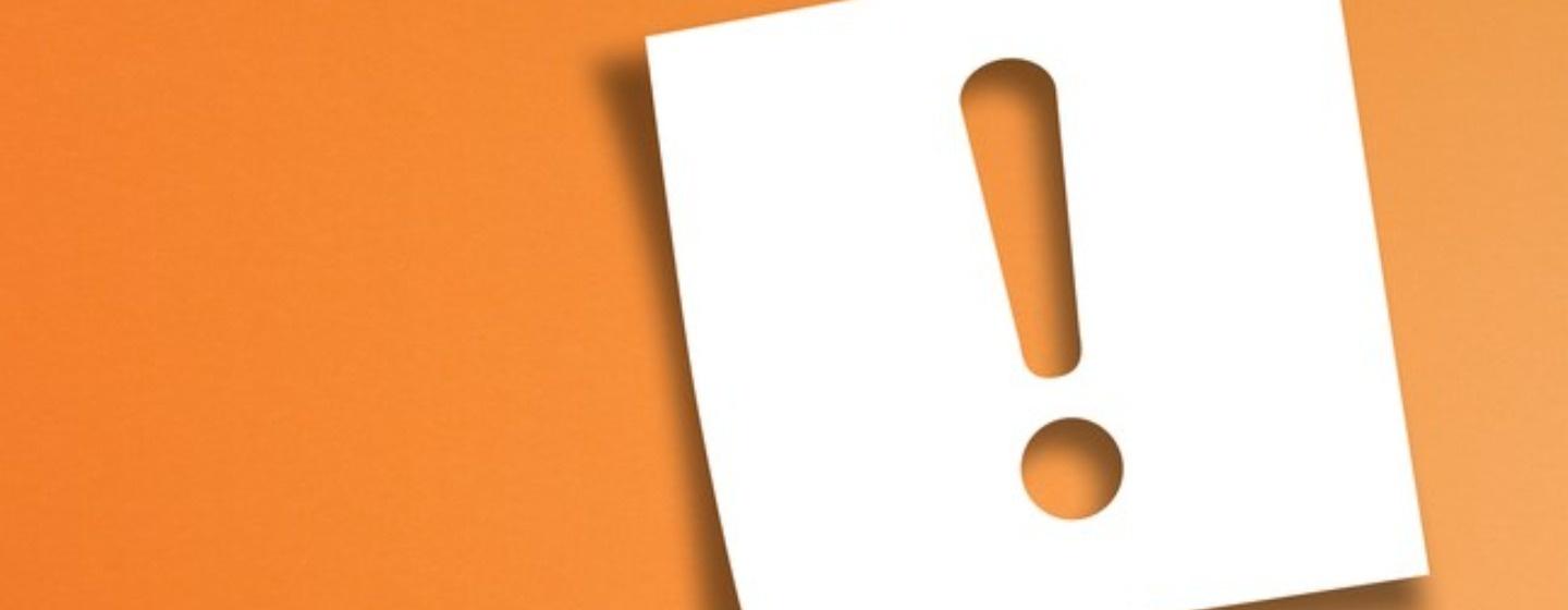 White exclamation mark on orange background